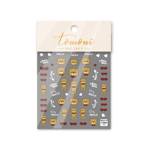 Macro detail of embossed cute cartoon bear nail stickers with 3D texture and heart motifs
