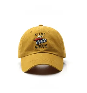 Detailed view of yellow cotton baseball cap featuring Surf Wave embroidery and stitching