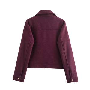 Rear view of a burgundy cropped wool jacket with gold buttons on the cuffs and back seam