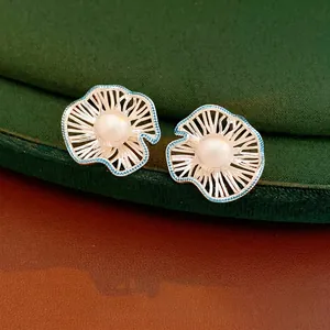 Elegant s925 silver hollow flower pearl earrings with blue texture and vintage design