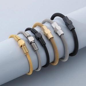 Detailed view of six stainless steel cable wire bracelets in gold, silver, and black colors