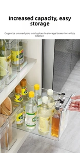 Detailed view of a transparent PET kitchen organizer box with an ergonomic handle cutout