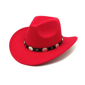 Detail of red cowboy hat with textured felt material and ethnic silver metal studs