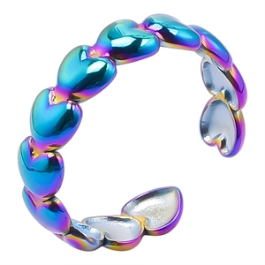 Macro shot of rainbow-colored heart-shaped open ring made of durable 304 stainless steel