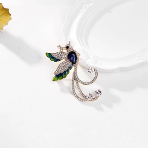 Exquisite phoenix brooch with blue teardrop gemstone and colorful enamel wing details