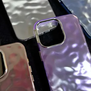 Close-up of metallic ripple texture iPhone cases with protective silver camera ring