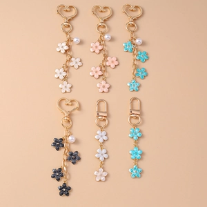 Sweet pearl cherry blossom keychains in multiple colors for bags and phones