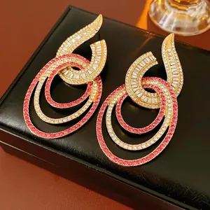 Golden geometric hollow earrings with pink and white crystal rhinestones for women