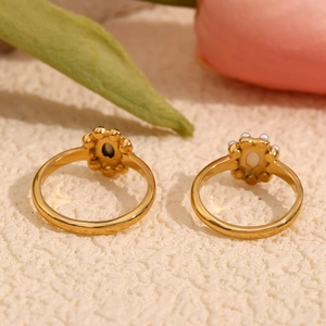 Detailed macro view of 18K gold plated flower ring with sparkling crystals and white pearl