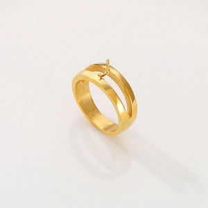 Detailed view of dual-band gold stainless steel ring with a J-shaped decorative hook