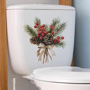 Weihnachts-WC-Aufkleber mit Zapfen und Beeren auf weißer Keramik für die Dekoration