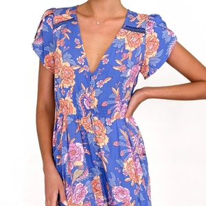Elegant blue floral V-neck dress with button-front design and ruffle sleeves for women