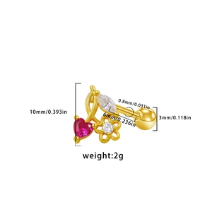 Detail view of gold stud earring with red heart stone and floral crystals with dimensions