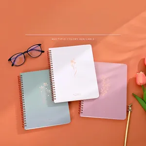 Minimalist A5 spiral notebook set in three colors with gold floral patterns and metal coils