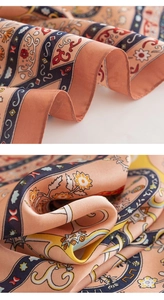 Detail of silk-like floral square scarf showing fine edge stitching and smooth texture