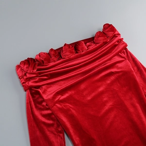 Detail of red velvet off-shoulder neckline with 3D handmade rose flower decorations