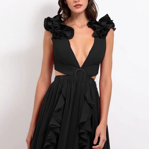 Close-up of 3D flower shoulder detail and waist cut-out on a black deep V-neck swimsuit
