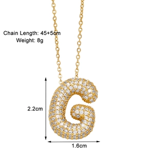 Detail of gold letter G pendant necklace with cubic zirconia and exact dimensions