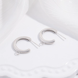 Close-up of S925 sterling silver C-shaped ear hooks with small loops for DIY jewelry making