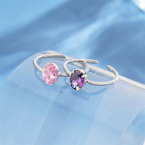 Macro detail of S925 sterling silver rings with pink and purple oval zircon stones