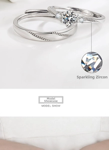 Detail of silver couple rings with sparkling cubic zirconia and classic six-prong setting
