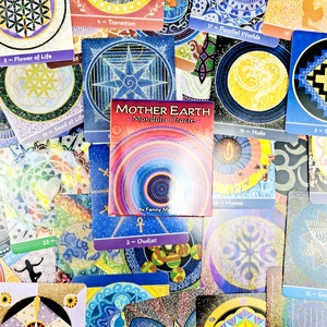 Detailed overhead view of Mother Earth Mandala Oracle cards and branded storage box