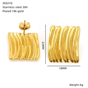 Detail of 18k gold plated curved leaf earrings showing exact size and 304 steel material
