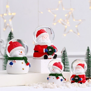 Christmas snow globe with Santa and Snowman figures on light-up resin base