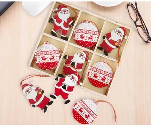 Christmas wooden dwarf and reindeer ornaments in a divided storage box on a desk