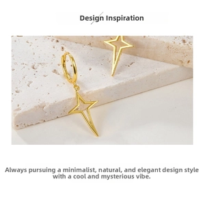 Detailed macro shot of gold four-pointed star earring showing S925 hallmark engraving