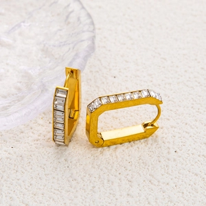 Detail of 18K gold plated bow earrings featuring rectangular cubic zirconia stones