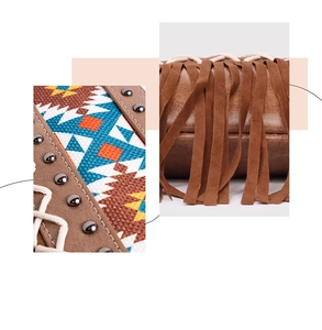 Close-up of bohemian canvas crossbody bag with suede fringe, ethnic fabric and rivets