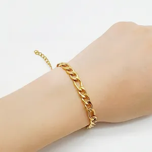Mens golden stainless steel Figaro link chain bracelet with adjustable extension on wrist