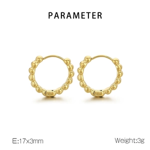 Detail of 17x3mm golden stainless steel beaded hoop earrings on white background