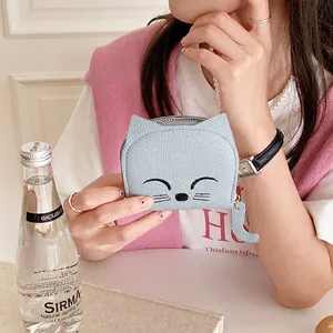 Light blue cat-shaped card holder with cute embroidery and cat tail zipper pull