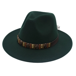 Dark green wide brim fedora hat with ethnic leather band and metallic shell ornaments