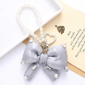 Elegant grey satin bow keychain with crystal inlay and decorative pearl chain
