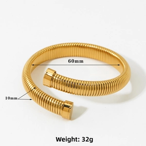 Detailed view of gold spiral spring cuff bracelet with 60mm diameter and 10mm width