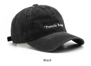 Detail of black washed denim baseball cap featuring white Pamela Rama embroidery