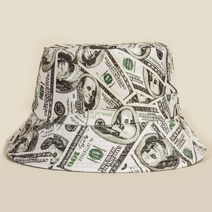 Detailed view of white canvas bucket hat featuring realistic $100 bill money print
