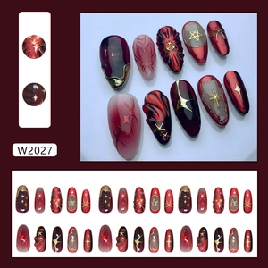 Gothic 3D star and bow press on nails with dark red cat eye and marble smudge design