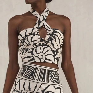 Detail of printed halter top and matching skirt featuring black shell pattern