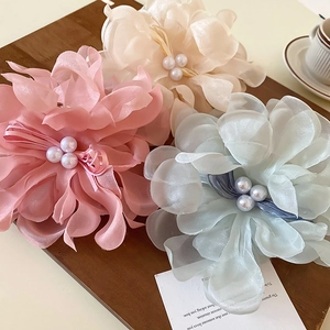Elegant floral lace hair claw with faux pearls in pastel pink, beige, and blue colors