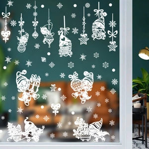 Detailed view of white Christmas window decals featuring Santa Claus and snowflakes