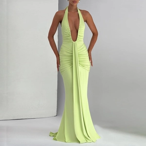 Elegant light green halter neck evening gown with deep V-neck and ruffled fishtail design