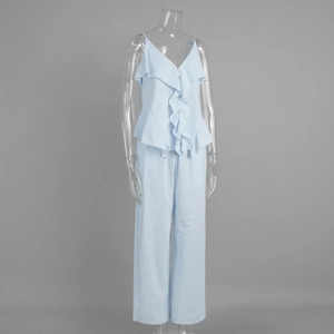 Detail of blue cotton set showing ruffle strap top and texture of wide-leg trousers