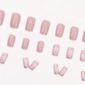 Pink press-on nails with silver glitter and marble patterns in a square shape