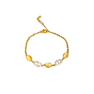 Bracelet doré avec pierres œil de chat jaunes et maillons nez de porc sertis de diamants