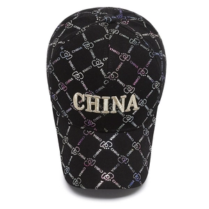 Black cotton baseball cap featuring gold CHINA embroidery and gradient monogram print