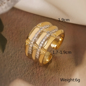 Macro shot of gold-plated wide open ring featuring sparkling pavé zircon details